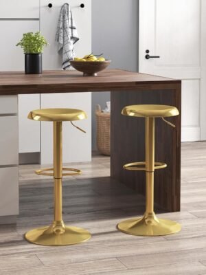 Set of two gold bar stools with a sleek brushed metal finish, featuring a round backless seat, adjustable height, and built-in footrests for comfort. #2