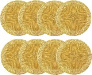 Set of 8 round gold beaded coasters with intricate handmade designs, perfect for protecting tables while adding a touch of elegance and sparkle.