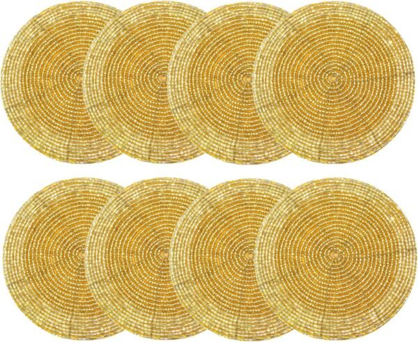 Set of 8 round gold beaded coasters with intricate handmade designs, perfect for protecting tables while adding a touch of elegance and sparkle.