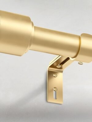 Close-up of a sleek gold curtain rod with a sturdy wall-mounted bracket, featuring a smooth metallic finish and minimalist design.