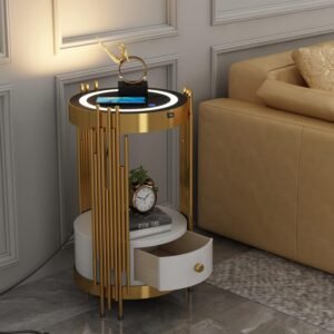 A chic gold accent table featuring a modern cylindrical design with vertical golden bars, a white drawer with a gold knob, and a polished gold base. Perfect for adding elegance and functionality to any living space