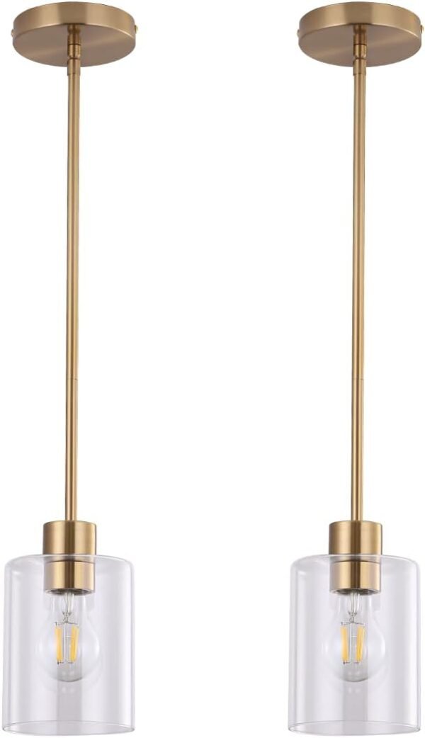 Set of two gold pendant light fixtures with brass finish and clear glass shades, featuring adjustable rods for modern kitchen or bar lighting.